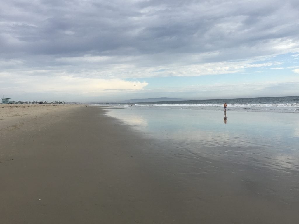 Wide sandy shoreline at Santa Monica Beach showing beach width and coastline