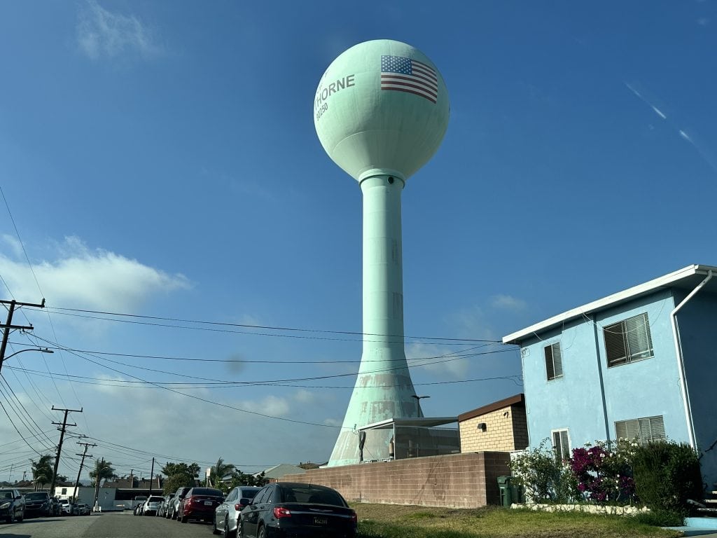 The Hawthorne water tower rising above the street, one of the city’s most recognizable landmarks.