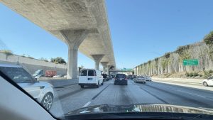 View of Los Angeles freeway traffic beneath an elevated roadway